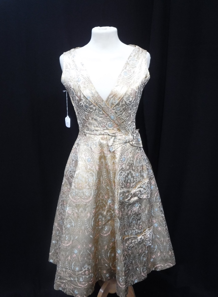 VINTAGE EVENING DRESS, circa 1950 in gold/blue and pink brocade, with bow detail to front