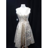 VINTAGE EVENING DRESS, circa 1950 in gold/blue and pink brocade, with bow detail to front