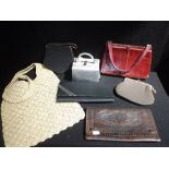 A COLLECTION OF VINTAGE HANDBAGS including a silver lamé box clutch evening bag, with serpent detail