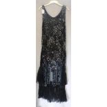 A 1920'S VINTAGE FLAPPER DRESS, decorated all over with sequins and beads