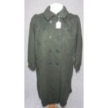 A VINTAGE 'LADYBIRD' CHILD'S GREEN WOOLLEN DOUBLE BREASTED OVERCOAT c. 1960 (age 10)