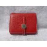 HERMES; A RED LEATHER LADIES PURSE/WALLET, in the Dogon style