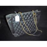 VINTAGE BLACK QUILTED HANDBAG: 'Chanel' style, with chain arm strap