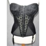 A VINTAGE WASPIE STYLE CORSET in black lace and satin 'Xtasy, by Silhouette'