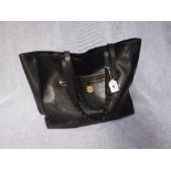 MULBERRY; A BLACK LEATHER LARGE TOTE BAG, the yellow metal 'Mulberry' disc to the front No. '