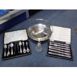 A SILVER PLATED BASKET, a set of six silver-handled knives, a silver mounted glass scent bottle