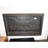 A LARGE CAST-IRON PLAQUE depicting the Last Supper, 30" wide