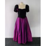 SUSY BELSHERE: A VINTAGE EVENING GOW circa 1980 with deep pink taffeta skirt and black bodice and