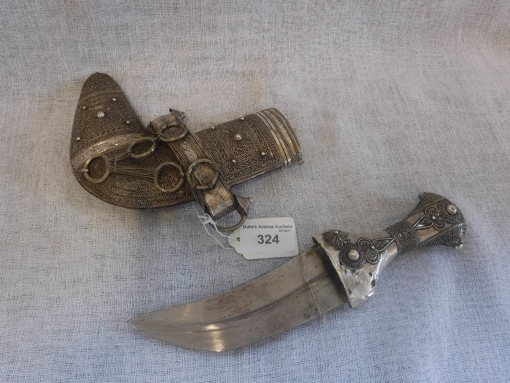 A YEMENI JAMBIYA, the handle and sheath with studded silver filigree decoration, 19th/20th