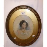 A PAIR OF 19TH CENTURY WATERCOLOUR PORTRAITS of a lady and gentleman in oval gilt frames