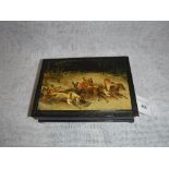 A BLACK LACQUERED CIGARETTE BOX, the lid decorated with a Russian scene of galloping horses and