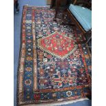 A BLUE GROUND PERSIAN RUG, 51" x 81"