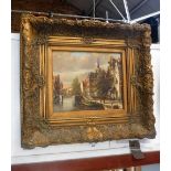 AN OIL ON PANEL PAINTING of a Dutch canal scene in gilt frame