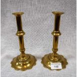 A PAIR OF 18TH CENTURY BRASS CANDLESTICKS with foliate bases 7" high