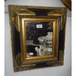 A GILT AND EBONISED FRAMED WALL MIRROR 17" high x 15" wide