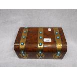 A VICTORIAN FIGURED WALNUT BOX with brass bands decorated with pale blue glass, 10" wide