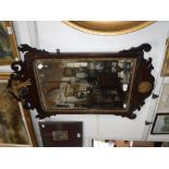 A CHIPPENDALE STYLE MAHOGANY FRAMED WALL MIRROR 35" high x 20.5" wide