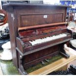 AN EARLY 20TH CENTURY MINIATURE TOY UPRIGHT PIANO, in a stained case, 24.75" high x 27" wide