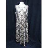 A VINTAGE BLACK GOLD AND TAN BROCADE EVENING DRESS with swirl decoration circa 1960's and three