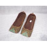 A PAIR OF ORIENTAL HOUSE SLIPPERS, decorated with turn-up green toes and embroidered throughout, a
