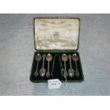 A SET OF SIX ENGRAVED SILVER COFFEE SPOONS AND SUGAR TONGS, in a fitted 'Goldsmith's & Silversmith's