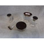 A TORTOISESHELL AND SILVER MOUNTED PART DRESSING TABLE SET comprising six dressing table pots and