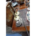 A PAIR OF BRASS SPIRAL CANDLESTICKS, a set of weights and a silver mounted walking cane