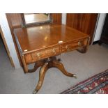 A 19TH CENTURY MAHOGANY SOFA TABLE on a central turned column with four swept down legs with brass