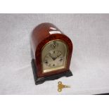 A 20TH CENTURY MANTEL CLOCK, with silvered dial and chime in a burr wood and ebonised case 8.25"