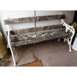 A VICTORIAN CAST-IRON BENCH with foliate decoration and wooden slats, 59" wide