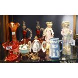 A PAIR OF VICTORIAN CRANBERRY GLASS DECANTERS, similar glassware, a pair of bisque figures, a