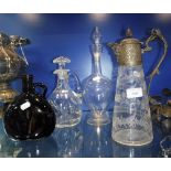 A VICTORIAN CUT-GLASS CLARET JUG with a silver plated mount with mask spout and Gothic style