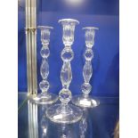 A SET OF THREE GEORGIAN STYLE GLASS CANDLESTICKS with facet-cut and slice-cut stems, 10.5" high (3)