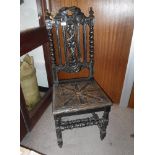 A VICTORIAN CARVED OAK HALL CHAIR