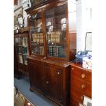 A 19TH CENTURY MAHOGANY LIBRARY BOOKCASE, the glazed upper section fitted adjustable shelves, the