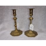 A PAIR OF 18TH CENTURY BRASS CANDLESTICKS with lobed bases, 7.5" high
