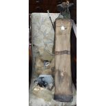 A COLLECTION OF VINTAGE GOLF CLUBS, contained in a vintage leather trimmed bag and a collection of