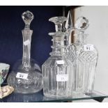 A COLLECTION OF CUT GLASS DECANTERS