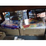A COLLECTION OF BOXED GAMES and a collection of Vintage games contained in a leather suitcase