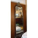 A QUEEN ANNE STYLE CHEVAL WALL MIRROR in a walnut and gilt frame 53" high x 19.5" wide