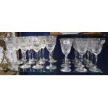 A SET OF TWELVE 'STUART' CUT GLASS WINE GOBLETS and eleven matching larger goblets