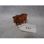 A CARVED WOODEN NETSUKE STYLE FIGURE OF A PIG