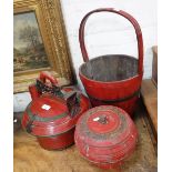 A CHINESE RED LACQUERED FOOD CARRIER, a similar pot and a red bound bucket (3)