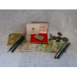 A SMALL COLLECTION OF FOREIGN COINAGE, bank notes, fountain pens and other items