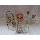 A COLLECTION OF SALMON PINK GUILLOCHE ENAMELLED PERFUME BOTTLES AND A JAR and a collection of