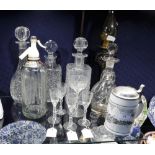 A COLLECTION OF GLASSWARE to include decanters and a stein
