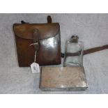 A LEATHER HUNTING PICNIC CARRIER with plated sandwich box and glass flask, stamped with initials '
