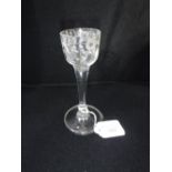 AN 18TH CENTURY WINE GLASS with straight-sided bowl with floral engraving on a tapering stem and