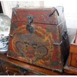 AN ORIENTAL RED LACQUERED BOX of canted form decorated with a dragon