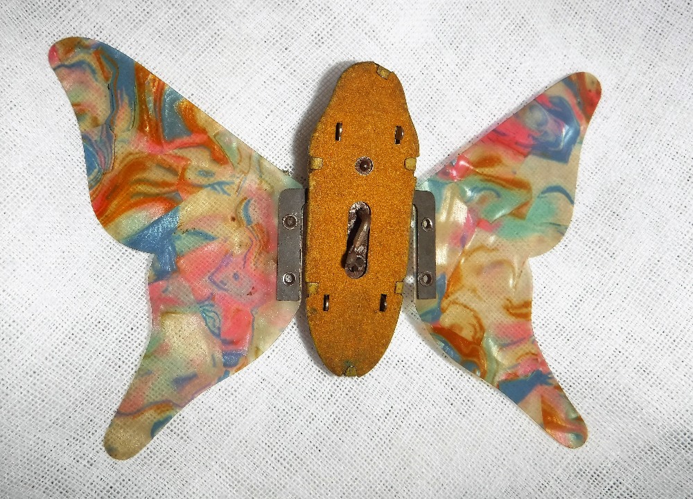 A VINTAGE GERMAN TIN PLATE CLOCKWORK BUTTERFLY with multi-coloured celluloid wings (with key) 4" - Image 2 of 2